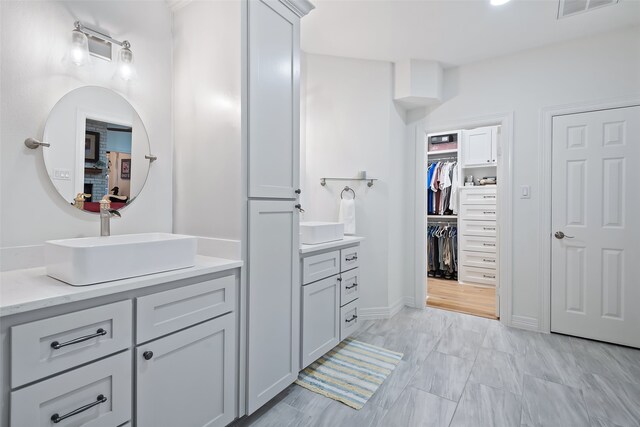 6602 Ranch Park Dr, Magnolia, TX 77354 - bathroom featuring vanity and a spacious closet
