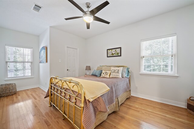 6602 Ranch Park Dr, Magnolia, TX 77354 - bedroom with light wood-type flooring and a ceiling fan