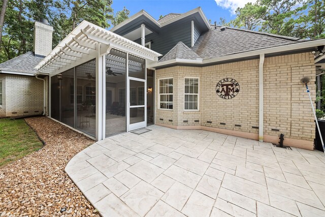 6602 Ranch Park Dr, Magnolia, TX 77354 - back of property with roof with shingles, a ceiling fan, brick siding, a patio, and a chimney
