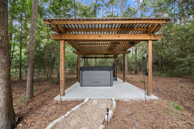 6602 Ranch Park Dr, Magnolia, TX 77354 - view of patio featuring a pergola and a hot tub