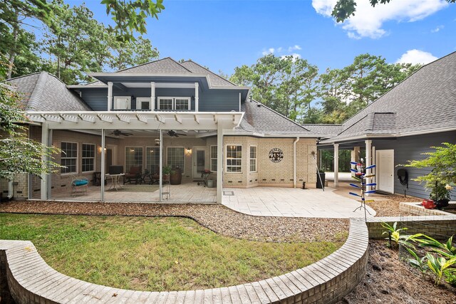 6602 Ranch Park Dr, Magnolia, TX 77354 - back of house with ceiling fan, roof with shingles, brick siding, and a patio