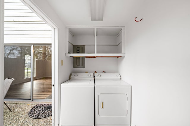 9650 Westview Dr, Houston, TX 77055 - laundry room featuring washer and clothes dryer and electric panel