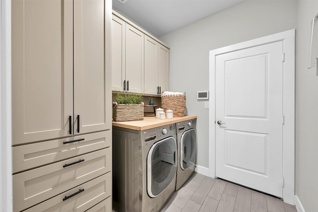 2411 Sunset Mist Ln, Conroe, TX 77304 - laundry room featuring cabinet space and independent washer and dryer