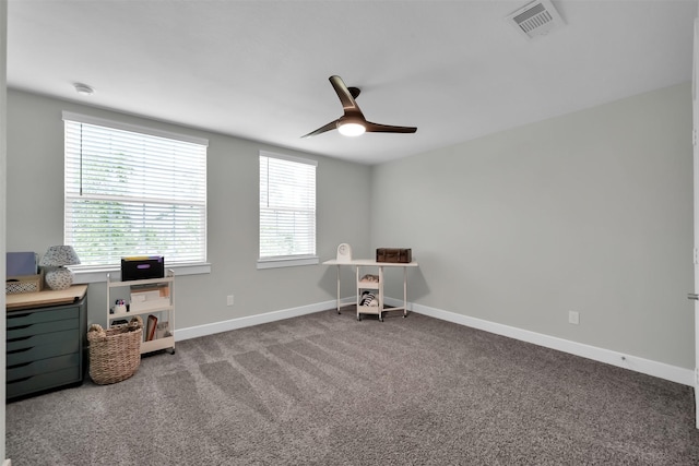 2411 Sunset Mist Ln, Conroe, TX 77304 - carpeted home office featuring a ceiling fan and baseboards