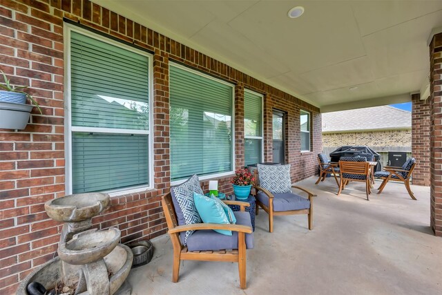 2411 Sunset Mist Ln, Conroe, TX 77304 - covered porch with outdoor dining area