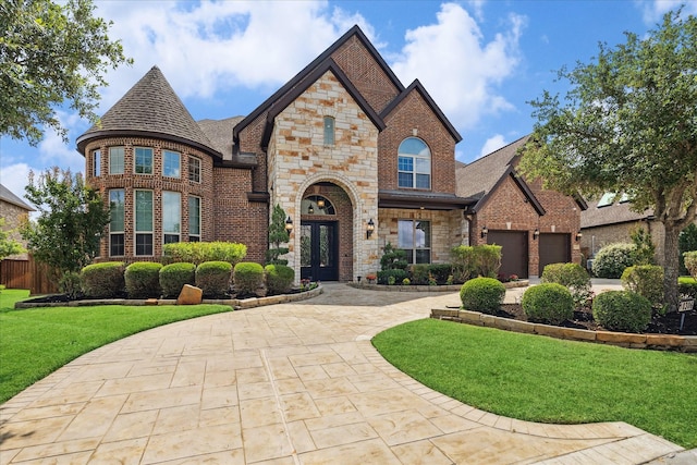 10306 Grape Creek Grove Ln, Cypress, TX 77433 - view of front of home featuring stone siding, driveway, a front yard, and brick siding
