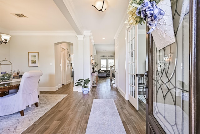 2424 Prairie Mist Ln, Friendswood, TX 77546 - entryway featuring ornamental molding, arched walkways, wood finished floors, french doors, and ornate columns