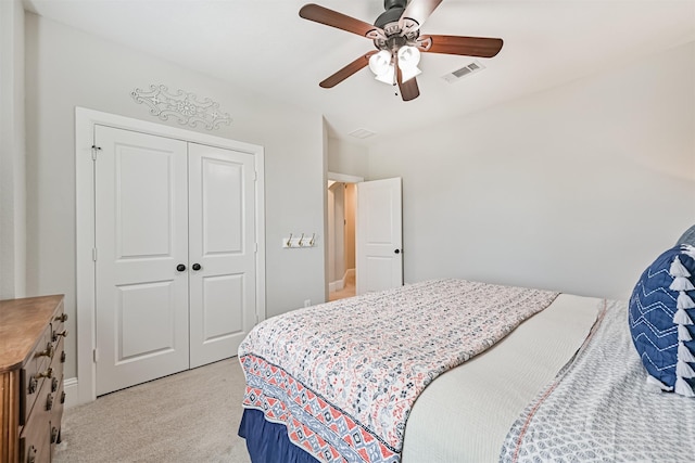 2424 Prairie Mist Ln, Friendswood, TX 77546 - bedroom with light colored carpet, a closet, and ceiling fan