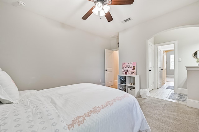 2424 Prairie Mist Ln, Friendswood, TX 77546 - bedroom featuring arched walkways and ceiling fan