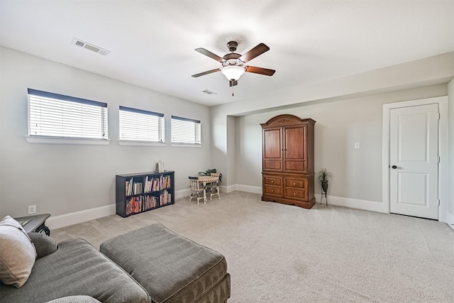 2424 Prairie Mist Ln, Friendswood, TX 77546 - living area with ceiling fan and light colored carpet