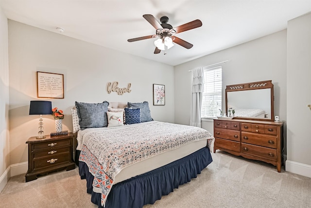 2424 Prairie Mist Ln, Friendswood, TX 77546 - bedroom featuring light carpet and a ceiling fan