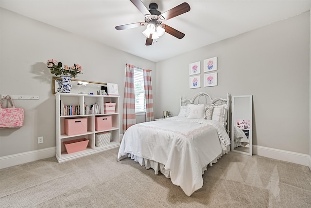 2424 Prairie Mist Ln, Friendswood, TX 77546 - carpeted bedroom featuring baseboards and ceiling fan