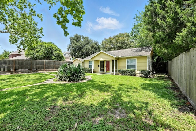 6305 S Rice Ave, Bellaire, TX 77401 - rear view of house with a fenced backyard