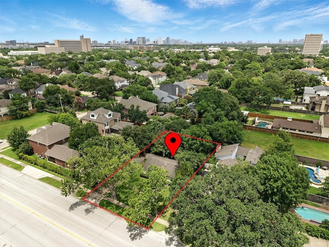 6305 S Rice Ave, Bellaire, TX 77401 - aerial view of property and surrounding area with property boundaries highlighted and city skyline