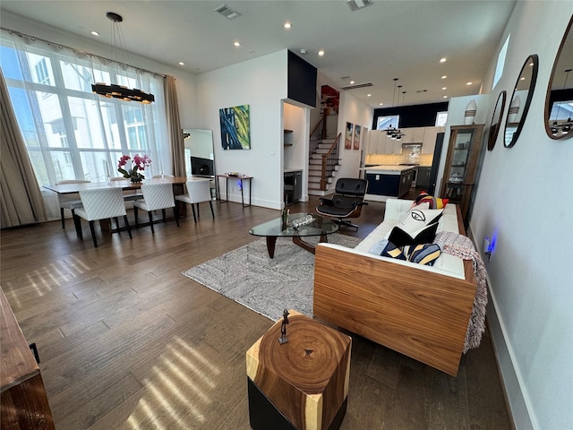 418 Bayou St, Houston, TX 77020 - living area with stairway, wood finished floors, and recessed lighting