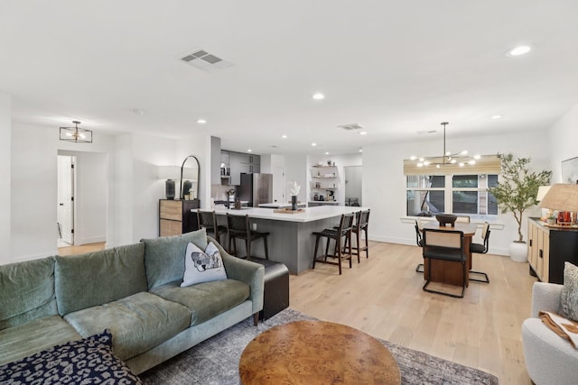 2327 Lamonte Ln, Houston, TX 77018 - living area with a chandelier, light wood-type flooring, and recessed lighting
