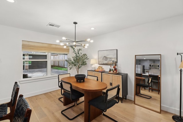 2327 Lamonte Ln, Houston, TX 77018 - dining space with a chandelier and light wood-style floors