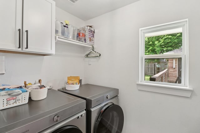 2327 Lamonte Ln, Houston, TX 77018 - laundry room featuring independent washer and dryer and cabinet space