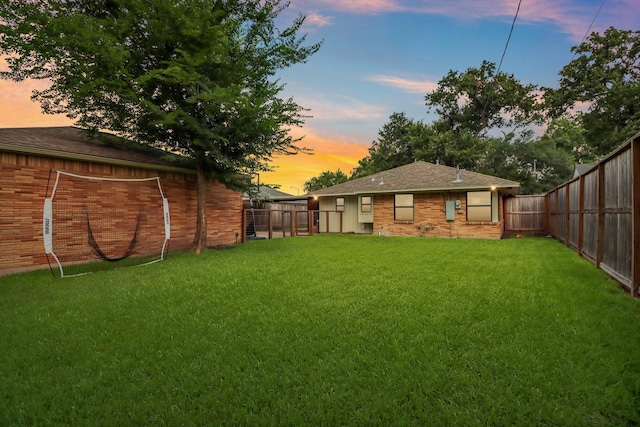 2327 Lamonte Ln, Houston, TX 77018 - yard at dusk with a fenced backyard