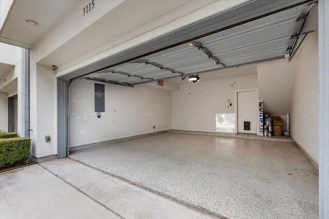 3115 Leeland St, Houston, TX 77003 - garage featuring a garage door opener and electric panel