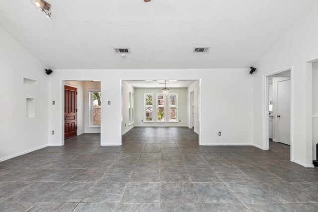 11406 Meadow Lake Dr, Houston, TX 77077 - empty room featuring stone finish flooring and lofted ceiling