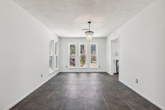 11406 Meadow Lake Dr, Houston, TX 77077 - unfurnished dining area featuring a chandelier and a textured ceiling