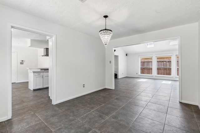11406 Meadow Lake Dr, Houston, TX 77077 - unfurnished dining area with a chandelier and a textured ceiling