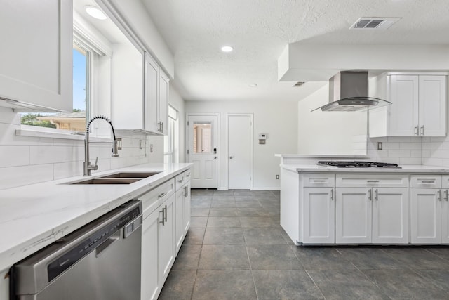11406 Meadow Lake Dr, Houston, TX 77077 - kitchen with stainless steel appliances, wall chimney exhaust hood, tasteful backsplash, white cabinetry, and a textured ceiling