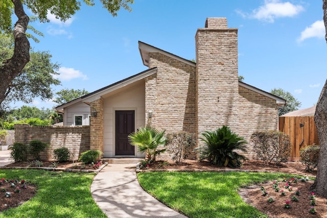 11406 Meadow Lake Dr, Houston, TX 77077 - mid-century home featuring a chimney and stone siding