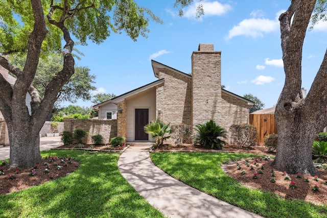 11406 Meadow Lake Dr, Houston, TX 77077 - mid-century modern home with a chimney and stone siding