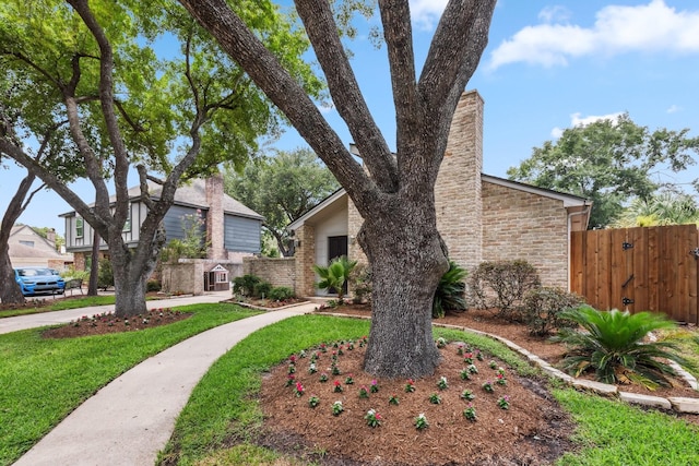 11406 Meadow Lake Dr, Houston, TX 77077 - view of front of home with a chimney and brick siding