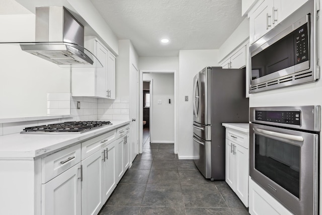 11406 Meadow Lake Dr, Houston, TX 77077 - kitchen featuring appliances with stainless steel finishes, ventilation hood, white cabinets, light countertops, and recessed lighting