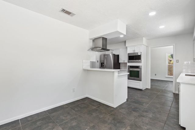 11406 Meadow Lake Dr, Houston, TX 77077 - kitchen with stainless steel appliances, island range hood, a peninsula, light countertops, and white cabinets