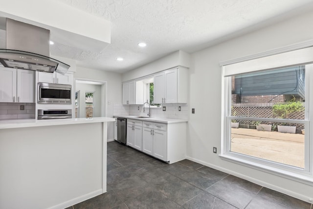 11406 Meadow Lake Dr, Houston, TX 77077 - kitchen with stainless steel appliances, a textured ceiling, tasteful backsplash, white cabinetry, and light countertops