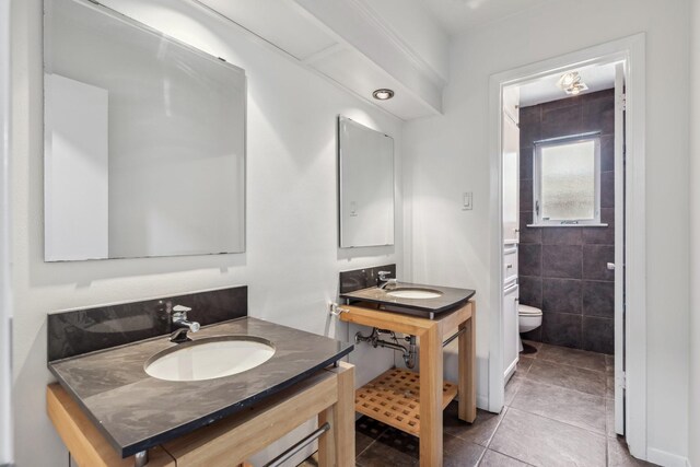 11406 Meadow Lake Dr, Houston, TX 77077 - bathroom featuring a sink and tile patterned flooring