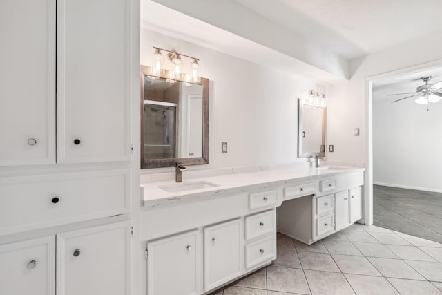11406 Meadow Lake Dr, Houston, TX 77077 - bathroom featuring double vanity, a ceiling fan, a shower stall, and tile patterned floors