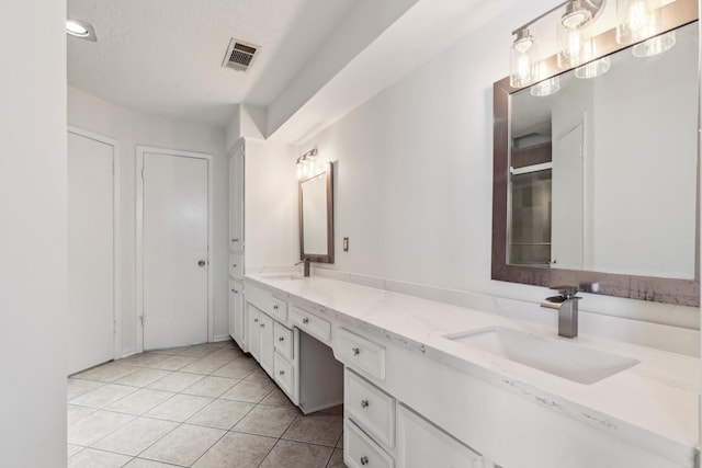11406 Meadow Lake Dr, Houston, TX 77077 - bathroom featuring double vanity and tile patterned flooring