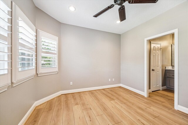 2215 Timbershade Ct, Magnolia, TX 77355 - spare room featuring a ceiling fan, light wood-style floors, and recessed lighting