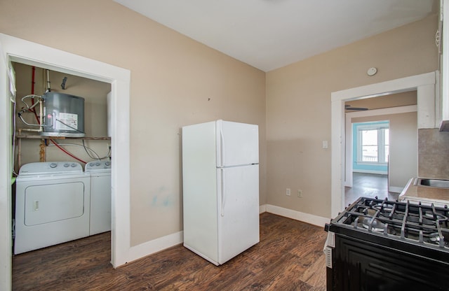 3412 Avenue S, Galveston, TX 77550 - kitchen featuring freestanding refrigerator, gas range oven, electric panel, independent washer and dryer, and dark wood-style flooring
