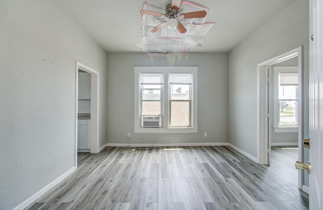 3412 Avenue S, Galveston, TX 77550 - unfurnished room featuring healthy amount of natural light, light wood-type flooring, and ceiling fan