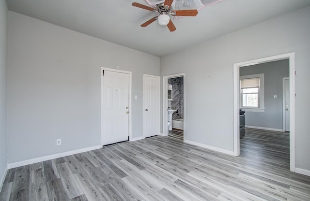 3412 Avenue S, Galveston, TX 77550 - unfurnished bedroom featuring light wood-style floors, connected bathroom, and ceiling fan