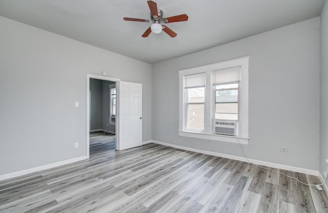 3412 Avenue S, Galveston, TX 77550 - unfurnished room featuring ceiling fan, light wood finished floors, and cooling unit