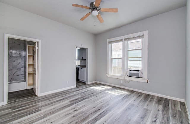 3412 Avenue S, Galveston, TX 77550 - unfurnished bedroom featuring light wood-style floors, cooling unit, and ceiling fan