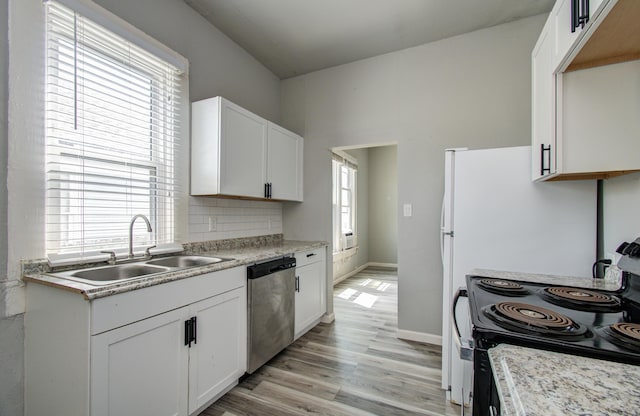 3412 Avenue S, Galveston, TX 77550 - kitchen featuring dishwasher, black electric range, backsplash, and light countertops