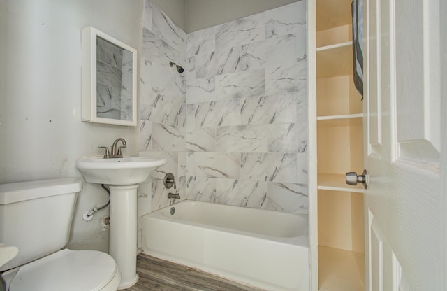 3412 Avenue S, Galveston, TX 77550 - bathroom featuring shower / washtub combination and wood finished floors