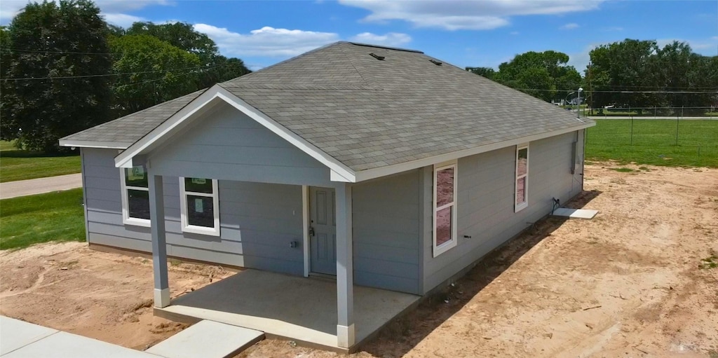 1041 Zero St, Hempstead, TX 77445 - back of property with roof with shingles and a porch