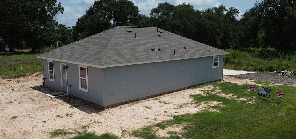 1041 Zero St, Hempstead, TX 77445 - view of home's exterior featuring a shingled roof