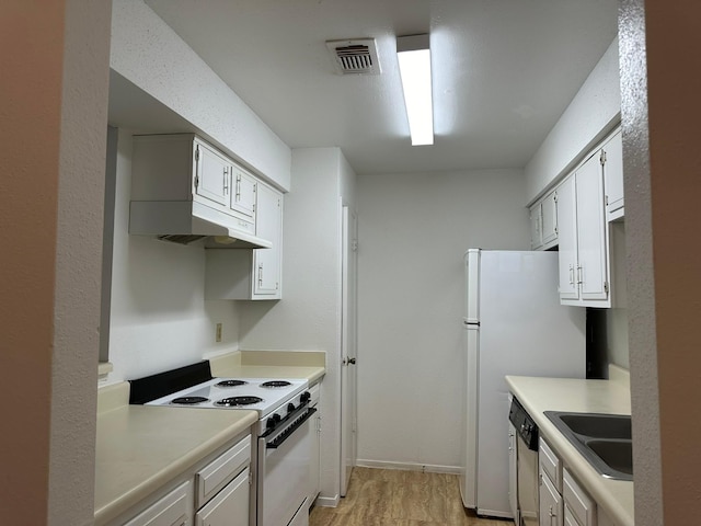 10555 Turtlewood Ct Unit 613, Houston, TX 77072 - kitchen with white appliances, under cabinet range hood, light countertops, and light wood-type flooring