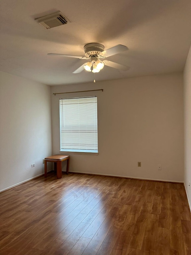 10555 Turtlewood Ct Unit 613, Houston, TX 77072 - spare room with a ceiling fan and wood finished floors