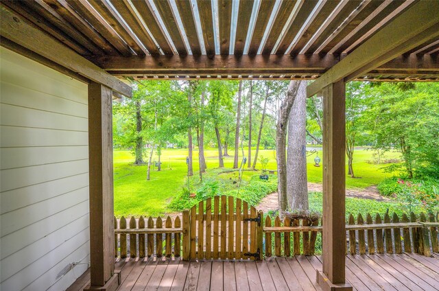 738 Stone Mountain Dr, Conroe, TX 77302 - wooden deck with a yard and view of wooded area